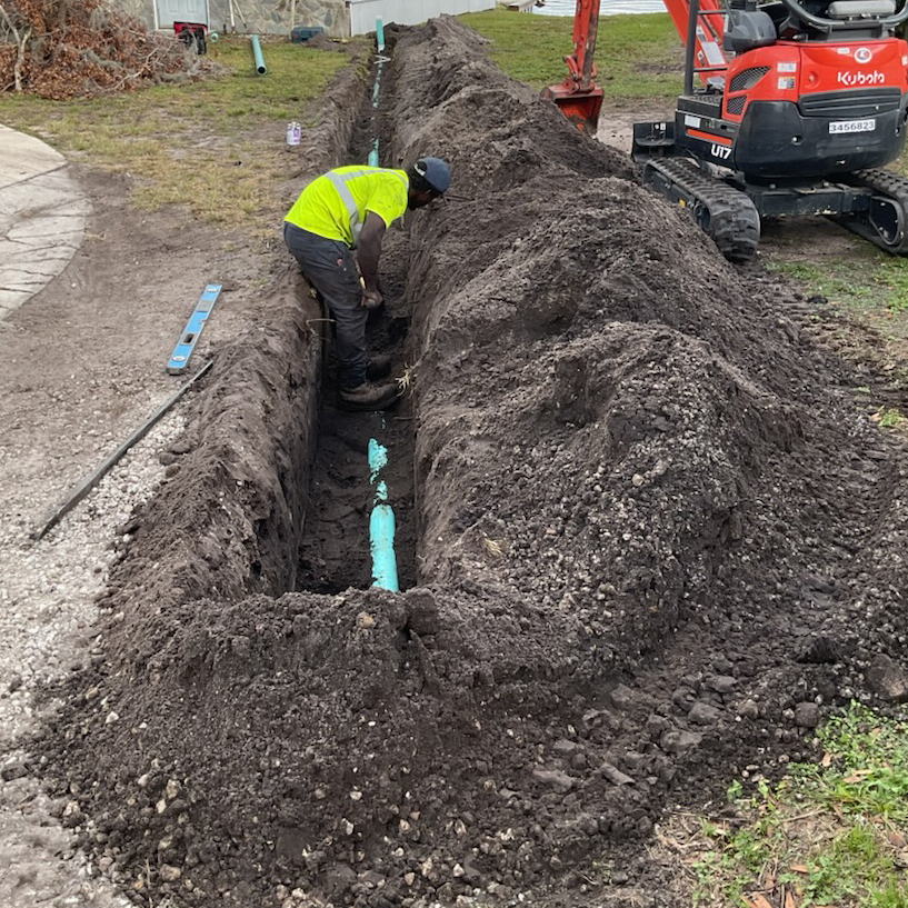 Man Digging For Pipe